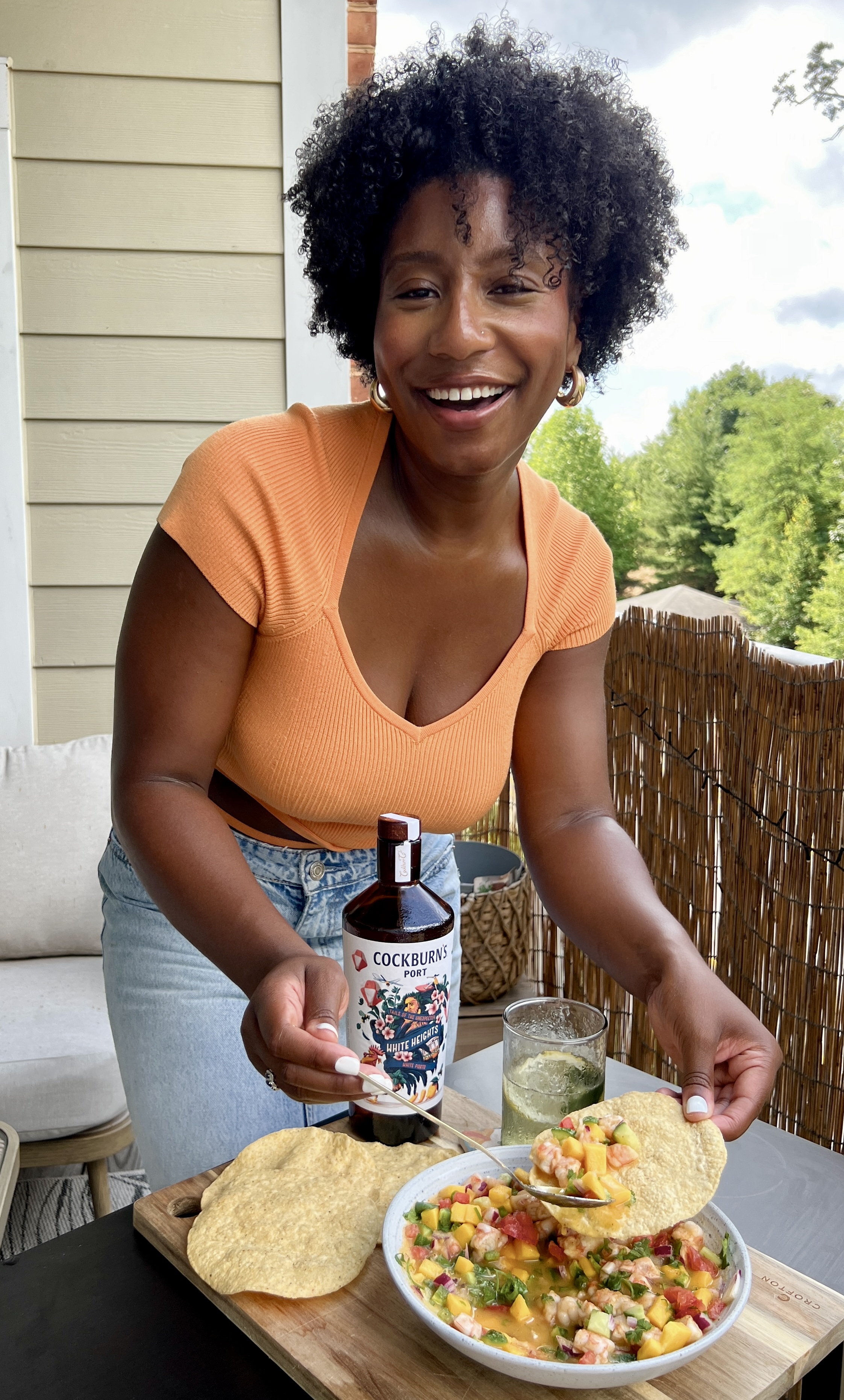 Desiree enjoying shrimp ceviche and white port and tonic